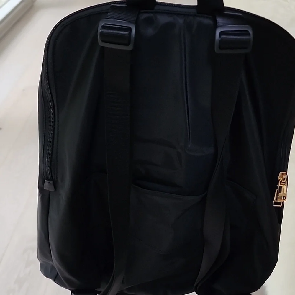 NWOT Tumi Just in Case Backpack in Black and Gold